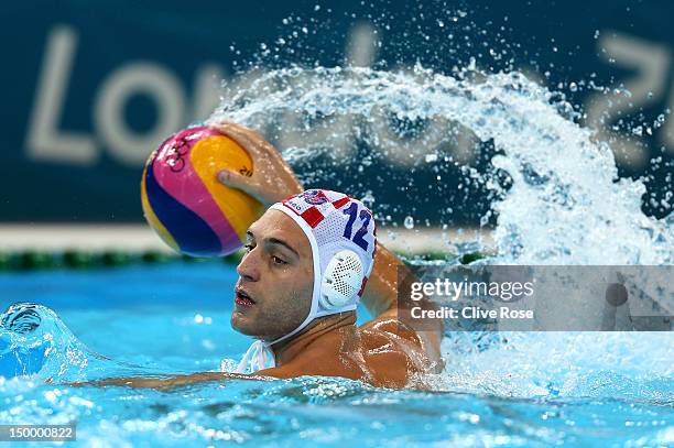 Paulo Obradovic of Croatia throws a pass in the Men's Water Polo Quarterfinal match between Croatia and the United States on Day 12 of the London...