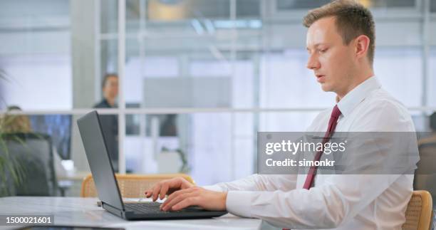 businessman using laptop - shirt and tie stock pictures, royalty-free photos & images
