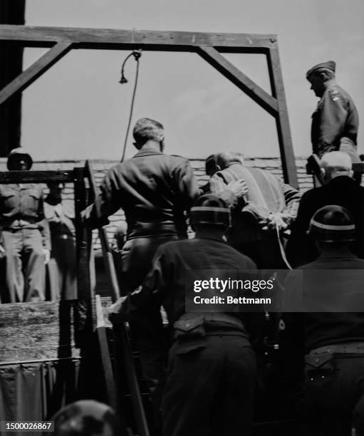 Claus Schilling ascending the gallows at Landsberg prison in Bavaria, Germany, May 28th 1946. Schilling, a tropical medicine specialist who...