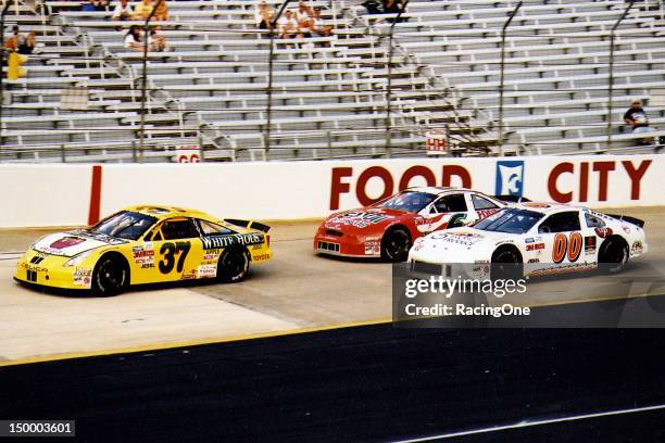 August 21, 2002: Robert Huffman in a Toyota leads the Pontiac of Gary Moore and the Mercury of Cam Strader during the Pabst Blue Ribbon 150 NASCAR...