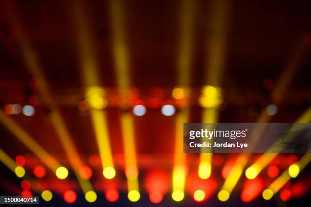 out of focus concert spot lights as background - stage light stock pictures, royalty-free photos & images