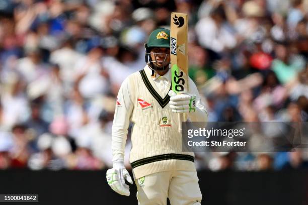 Usman Khawaja of Australia raises their bat after reaching their half-century during Day Five of the LV= Insurance Ashes 1st Test match between...