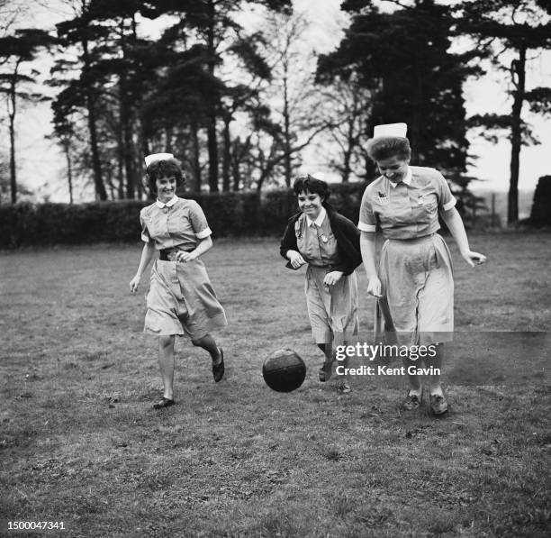 Nurses from St Albans City Hospital playing football in preparation for a match against a local boys team, Staff nurse Sandy Gatskill, centre half,...