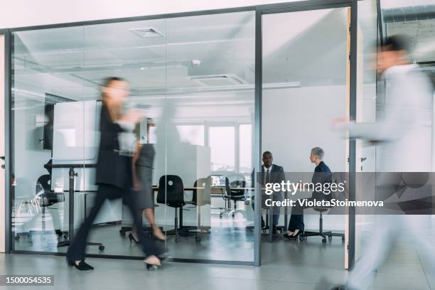 business partners on meeting in the office. - blurred motion business stock pictures, royalty-free photos & images