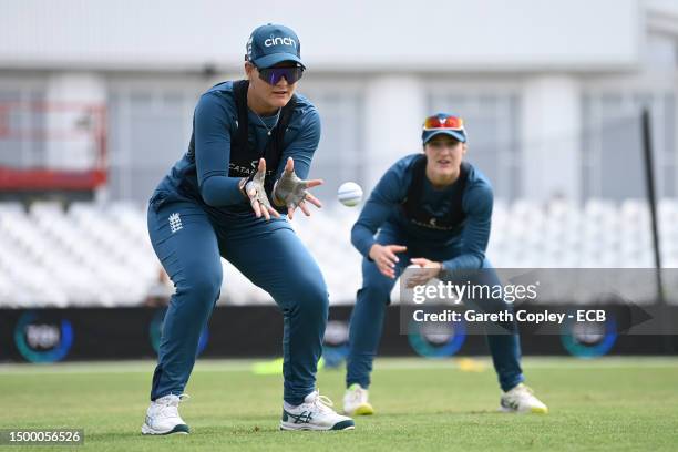 Danielle Gibson of England catches watched by Emma Lamb during a nets session at Trent Bridge on June 20, 2023 in Nottingham, England.