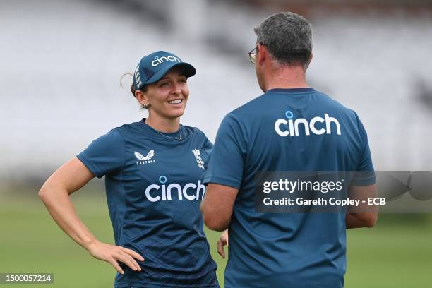 Kate Cross of England speaks with coach John Lewis during a nets session at Trent Bridge on June 20, 2023 in Nottingham, England.