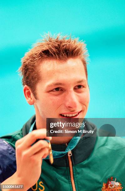 Ian Thorpe of Australia with his gold medal after winning the 400m Freestyle in a new world record during the Olympics at the Sydney International...