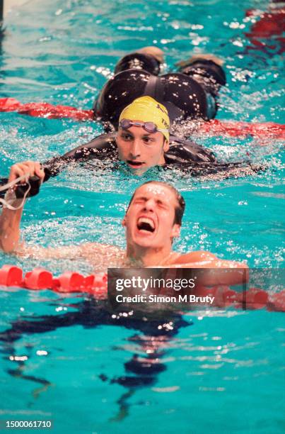 Ian Thorpe of Australia swims over to Pieter van den Hoogenband of the Netherlands who won the Mens 200m Freestyle during the Olympics at the Sydney...