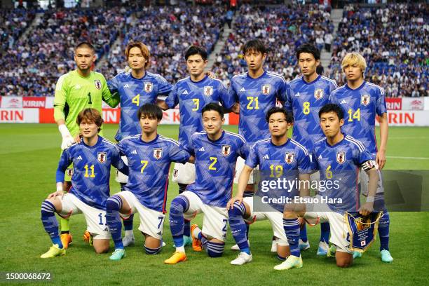 Players of Japan line up for team photos prior to the international friendly match between Japan and Peru at Panasonic Stadium Suita on June 20, 2023...