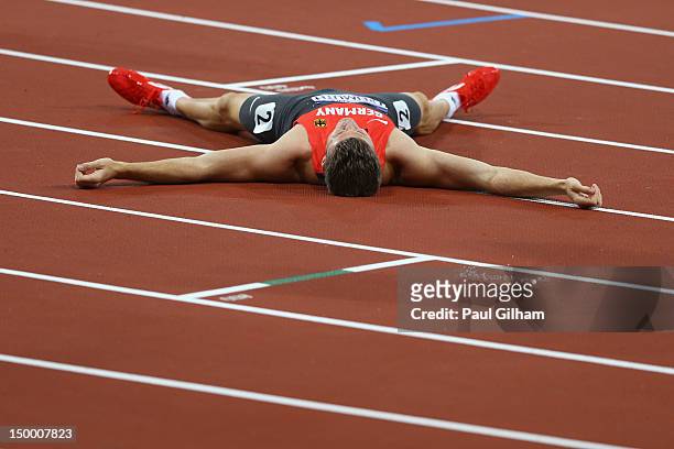Pascal Behrenbruch of Germany layes on the ground after competing in the Men's Decathlon 400m Heats on Day 12 of the London 2012 Olympic Games at...