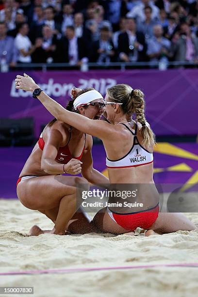 Kerri Walsh Jennings and Misty May-Treanor of the United States celebrate winning the Gold medal in the Women's Beach Volleyball Gold medal match...