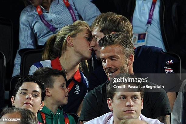 British cyclists Laura Trott and Jason Kenny kiss during the Beach Volleyball on Day 12 of the London 2012 Olympic Games at Horse Guards Parade on...