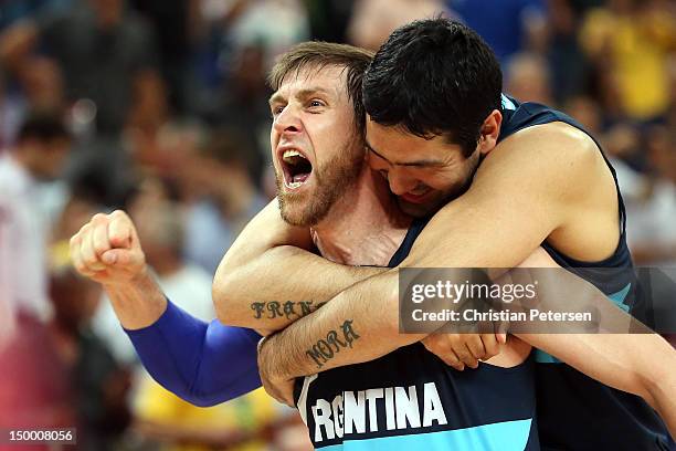 Andres Nocioni and Martin Leiva of Argentina celebrate Argentina's 82-77 victory against Brazil during the Men's Basketball quaterfinal game on Day...