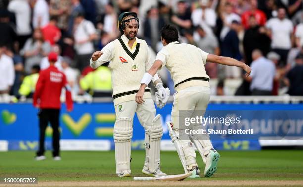 Pat Cummins of Australia celebrates after hitting the winning runs to defeat England with teammate Nathan Lyon during Day Five of the LV= Insurance...