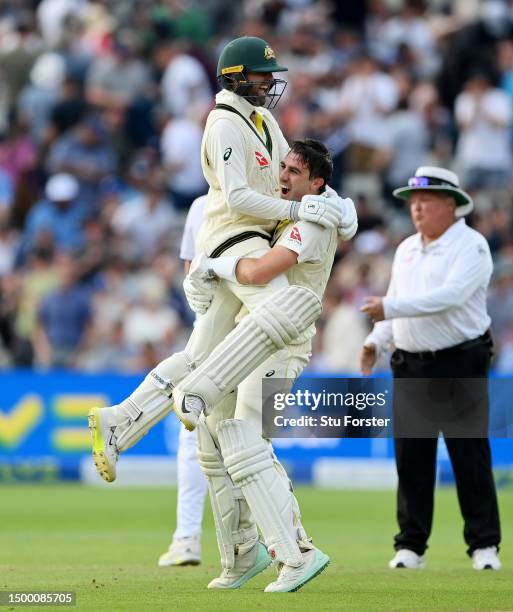 Pat Cummins of Australia celebrates after hitting the winning runs to defeat England with teammate Nathan Lyon during Day Five of the LV= Insurance...