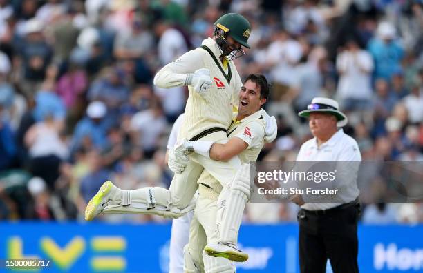 Pat Cummins of Australia celebrates after hitting the winning runs to defeat England with teammate Nathan Lyon during Day Five of the LV= Insurance...