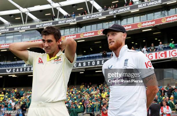 Pat Cummins of Australia and Ben Stokes of England look on after Australia defeat England during Day Five of the LV= Insurance Ashes 1st Test match...