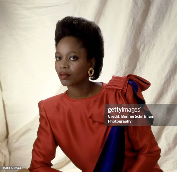 American actress Alfre Woodard poses for a portrait wearing a red dress in Los Angeles, California, circa 1987.