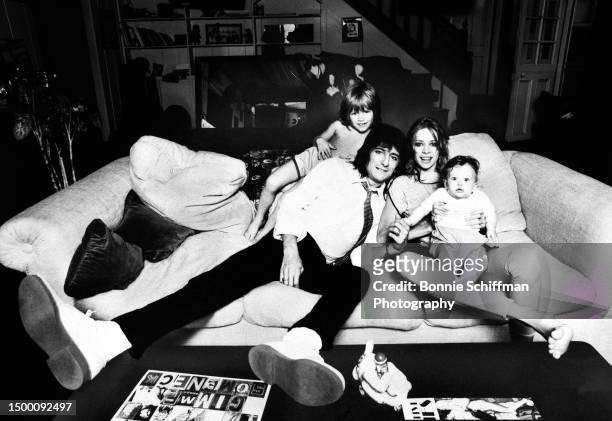 English musician Ronnie Wood, of the Rolling Stones, poses for a portrait with his wife Jo, son Jamie and daughter Leah, on Jo's lap, at home in Los...