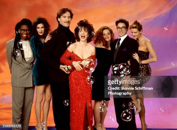 American actors Whoopi Goldberg, Teri Hatcher, Kevin Kline, Sally Field, Elisabeth Shue, Robert Downey Jr. And a stand-in for Cathy Moriarty, pose...