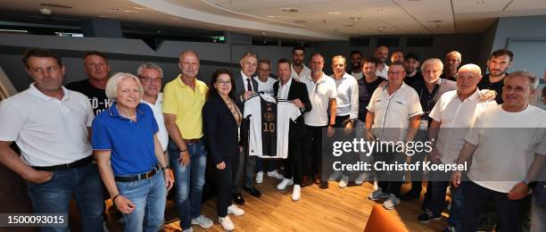 The All-Stars pose with Bernd Neuendorf, DFB president during the DFB All-Stars meeting at Veltins Arena on June 20, 2023 in Gelsenkirchen, Germany.