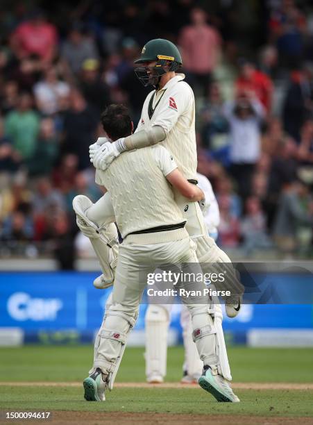 Pat Cummins of Australia and Nathan Lyon of Australia celebrate victory during Day Five of the LV= Insurance Ashes 1st Test match between England and...