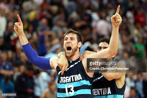 Andres Nocioni and Martin Leiva of Argentina celebrate Argentina's 82-77 victory against Brazil during the Men's Basketball quaterfinal game on Day...