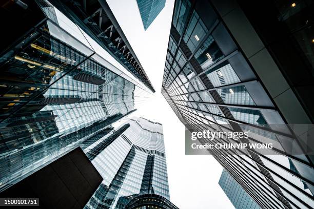 looking directly up at the skyline of the financial district in central london - commercial real estate as investment increases stock pictures, royalty-free photos & images