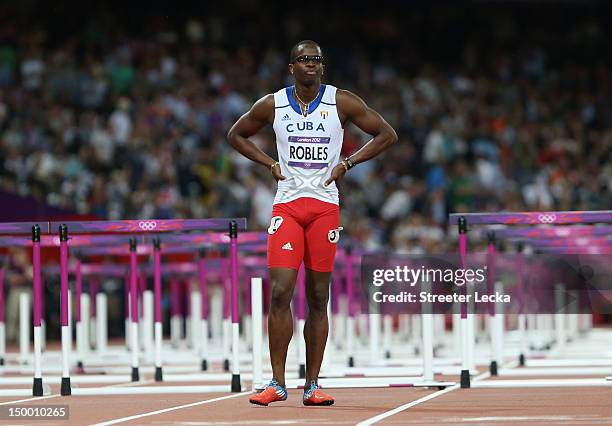 Dayron Robles of Cuba looks on after pulling up injured in the Men's 110m Hurdles Final on Day 12 of the London 2012 Olympic Games at Olympic Stadium...