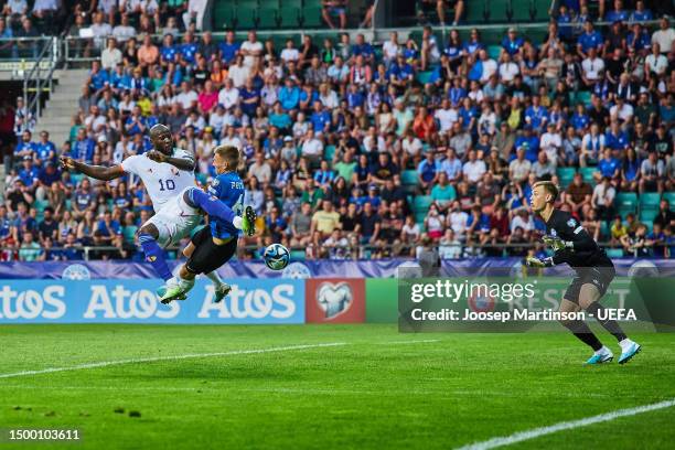 Romelu Lukaku of Belgium attempts to shoot before Rasmus Peetson of Estonia scores an own goal, Belgium's first goal during the UEFA EURO 2024...