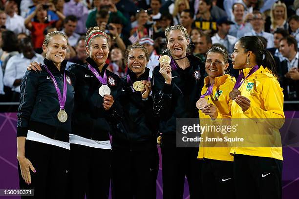 Silver medallists Jennifer Kessy and April Ross of the United States, Gold medallists Misty May-Treanor and Kerri Walsh Jennings, and Bronze...