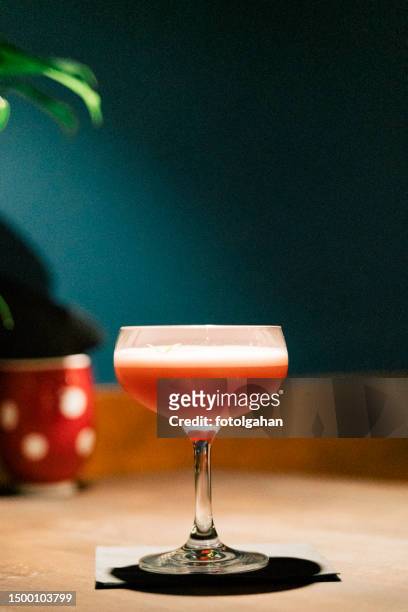 closeup glass with alcohol in cocktail bar - craft cocktail stock pictures, royalty-free photos & images