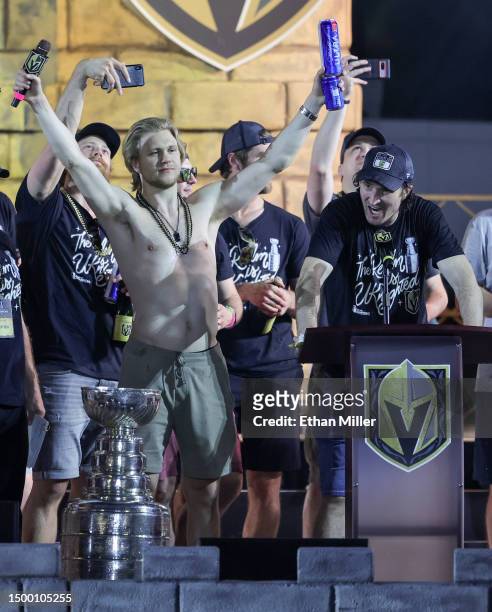 Laurent Brossoit of the Vegas Golden Knights records images on his phone as William Karlsson and Mark Stone address the crowd onstage during a...