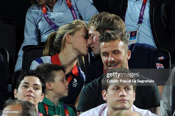 British cyclists Laura Trott and Jason Kenny kiss during the Beach Volleyball on Day 12 of the London 2012 Olympic Games at Horse Guards Parade on...