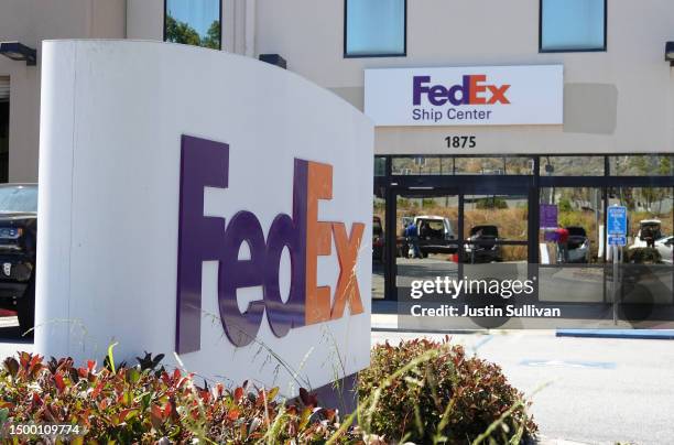 Sign is posted in front of a FedEx shipping center on June 20, 2023 in San Francisco, California. Shipping giant FedEx reported better-than-expected...