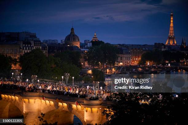 Models parade down Pont Neuf Bridge during the Louis Vuitton Menswear  News Photo - Getty Images