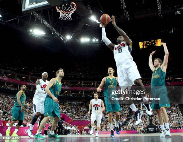 LeBron James of United States goes up for a shot between David Andersen and Joe Ingles of Australia in the first half during the Men's Basketball...