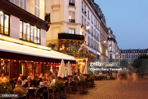 paris streets at dusk - bar paris stock pictures, royalty-free photos & images