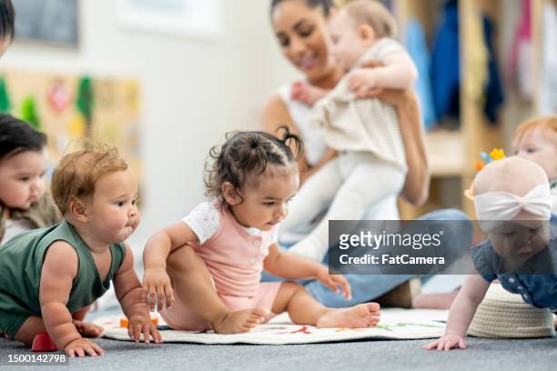 a day at daycare - child care stockfoto's en -beelden