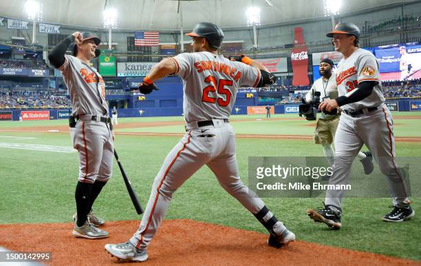 Anthony Santander of the Baltimore Orioles is congratulated after hitting a home run in the first inning during a game against the Tampa Bay Rays at...