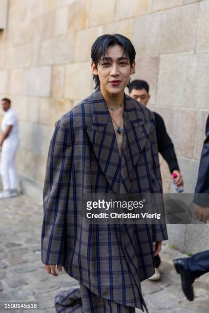 Bambam wears oversized checkered jacket outside Louis Vuitton during the Menswear Spring/Summer 2024 as part of Paris Fashion Week on June 20, 2023...