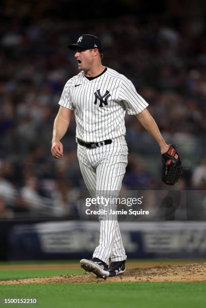 Starting pitcher Gerrit Cole of the New York Yankees reacts after a strikeout during the 7th inning of the game against the Seattle Mariners at...