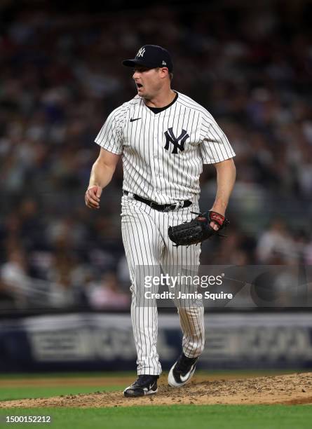 Starting pitcher Gerrit Cole of the New York Yankees reacts after a strikeout during the 7th inning of the game against the Seattle Mariners at...