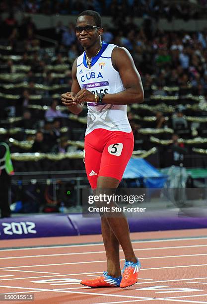 Dayron Robles of Cuba limps across the finish line in the Men's 110m Hurdles Final on Day 12 of the London 2012 Olympic Games at Olympic Stadium on...