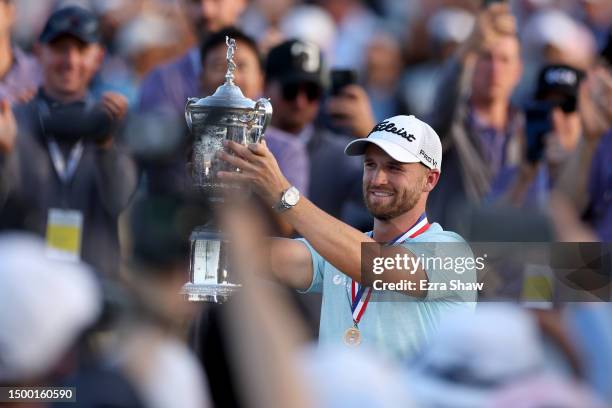 Wyndham Clark of the United States poses with the trophy after winning during the final round of the 123rd U.S. Open Championship at The Los Angeles...