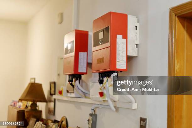 solar energy upgradeable indoor hybrid inverter installed in the basement of a residential building. - lagerhaltung stock-fotos und bilder