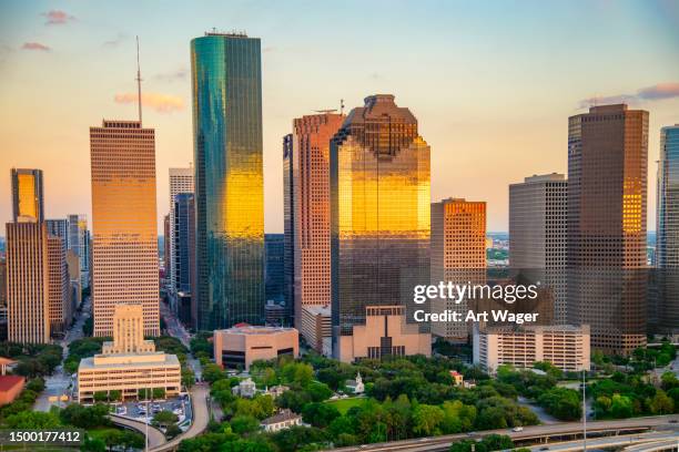 downtown houston at sunset - houston real estate market stock pictures, royalty-free photos & images