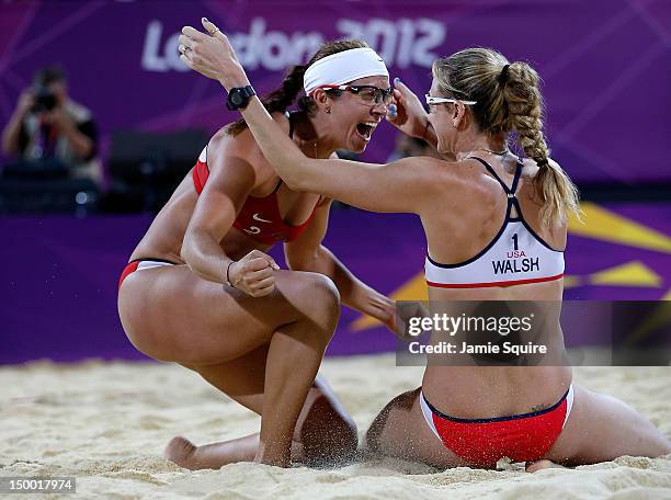 Kerri Walsh Jennings and Misty May-Treanor of the United States celebrate winning the Gold medal in the Women's Beach Volleyball Gold medal match...