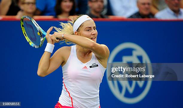 Ksenia Pervak of Kazakhstan returns to Petra Kvitova of the Czech Republic during round two of the Rogers Cup at the Uniprix Stadium on August 8,...