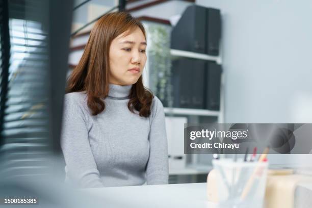 unhappy female employee portrait in office. - bullying stock pictures, royalty-free photos & images
